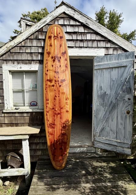 Finished. Nine feet of hollow cedar, standing at the shack door.
