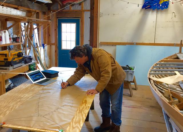 Drawing lines on the boat shop floor.