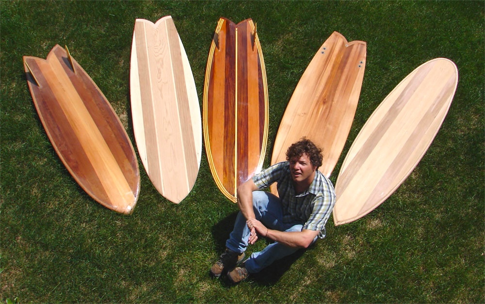 Rich with his quiver of wooden surfboards